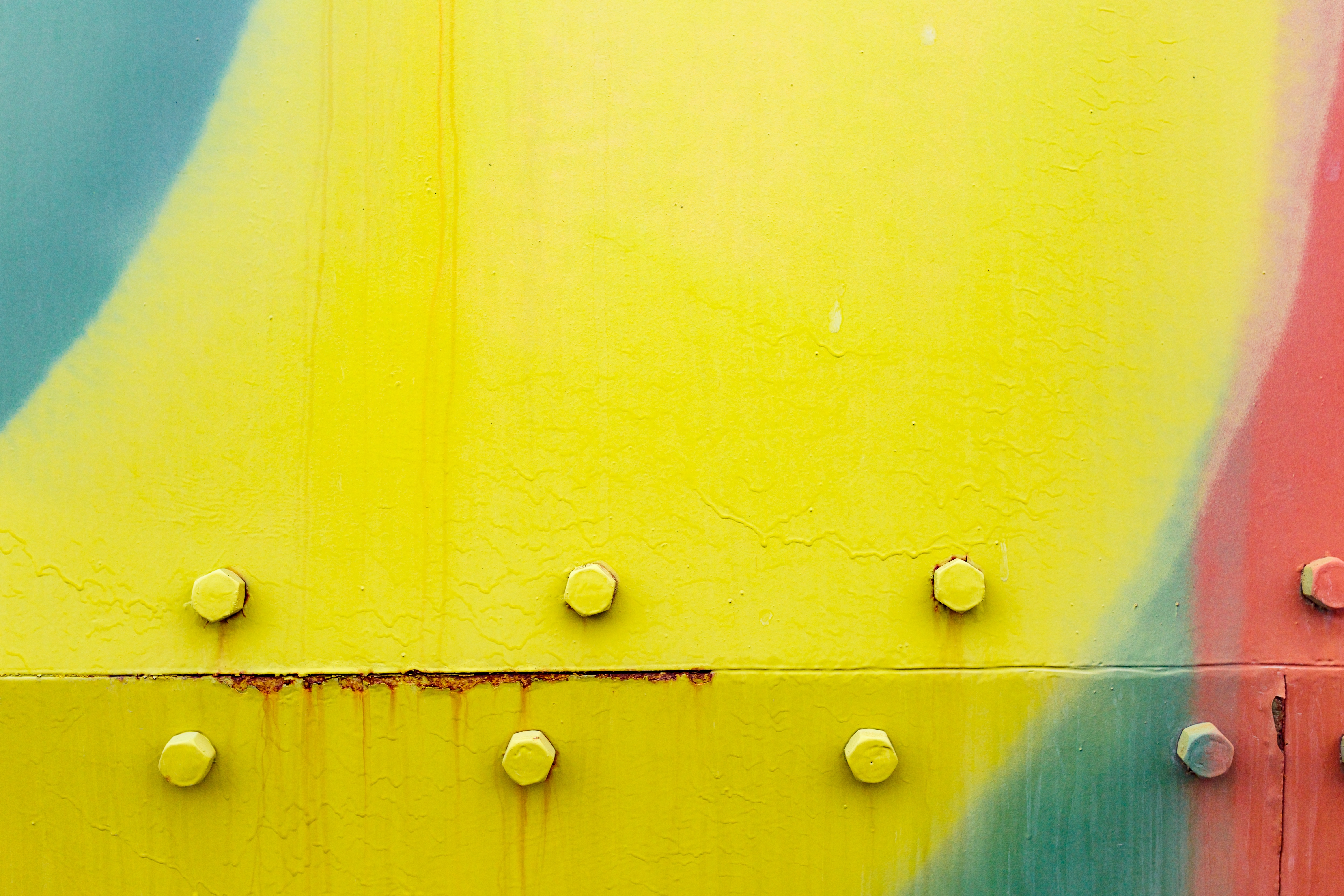 Abstract green industrial metal background texture with bolts and rivets. Old painted metal